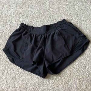 Lululemon Hotty Hot shorts 2.5 in low-rise. Color is black.